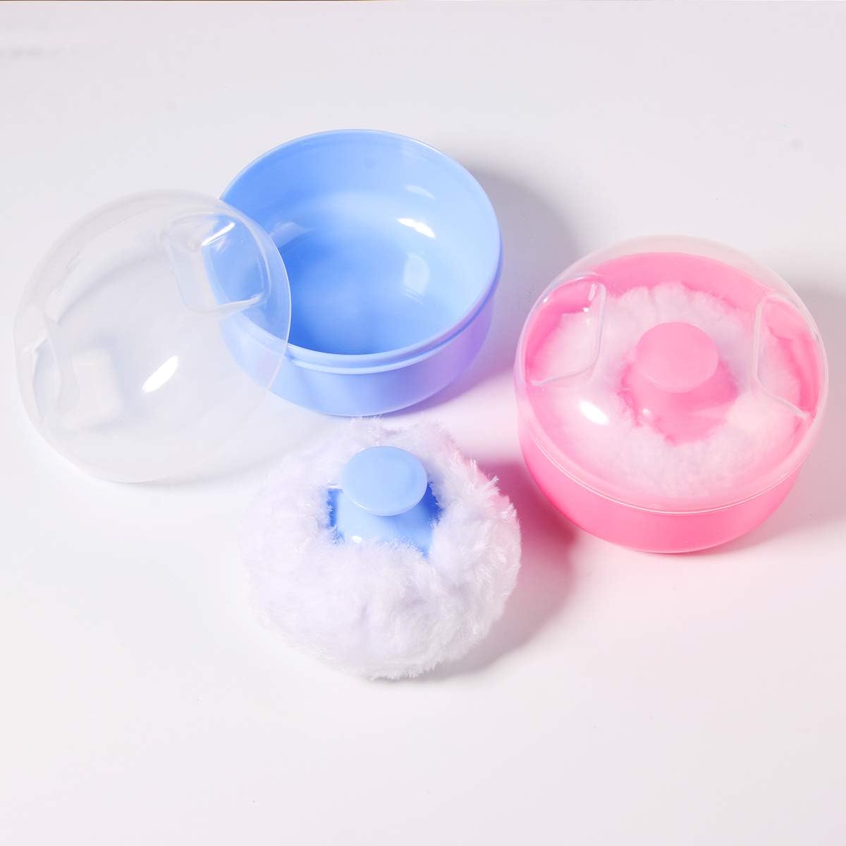 Two compact powder puff containers in pink and blue with soft acrylic puffs inside - 2